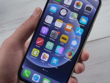 Close up of man holding iPhone